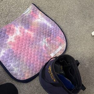 Horse saddle pad and brush’s in carrier